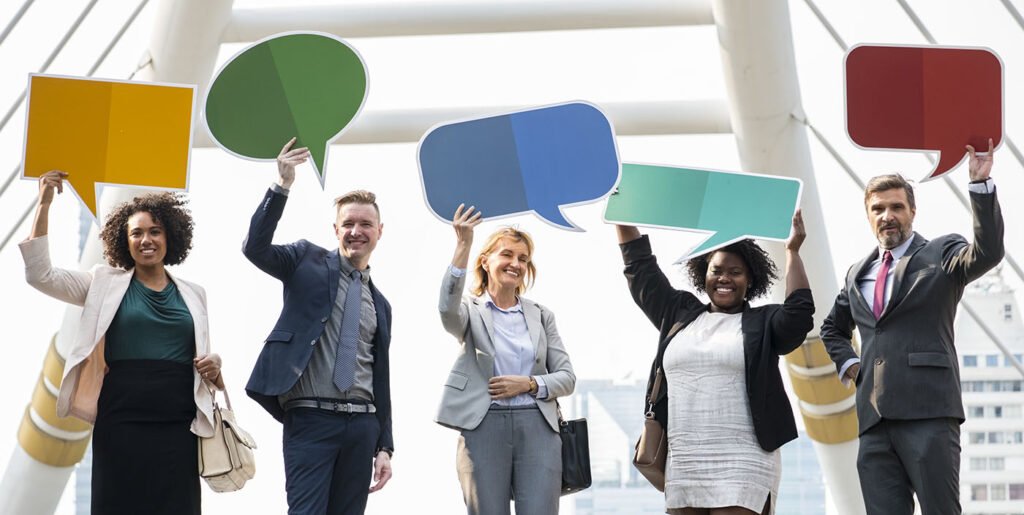 group of businesspeople holding speech bubble signs - Digital Marketing Agency